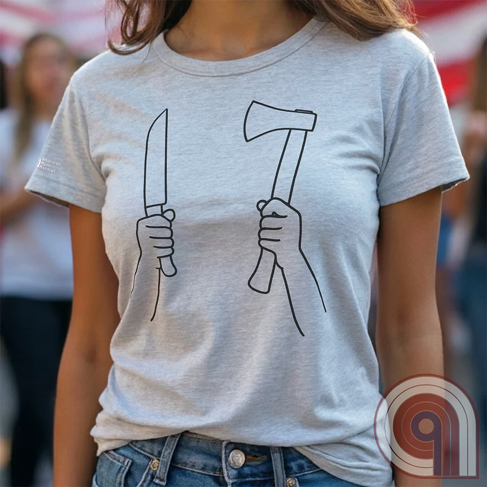 Light ash-gray T-shirt worn by a model, showing two large black line illustrations of fists clasping a straight knife and a hatchet.