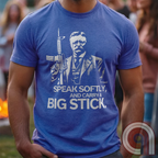 Striking Teddy Roosevelt 2A T-Shirt - legendary Rough Rider and American icon, with an AR-15 and his, 'Speak Softly, and Carry a Big Stick.' This design is a fearless blend of patriotism, rugged individuality, & Second Amendment rights. Perfect for gun lovers, history buffs, & freedom fighters who embrace bold American values. Pro-Second Amendment clothing that makes a statement—real leaders don’t ask permission to defend liberty. A tribute to freedom, strength, and the right to bear arms. Color- Blue1