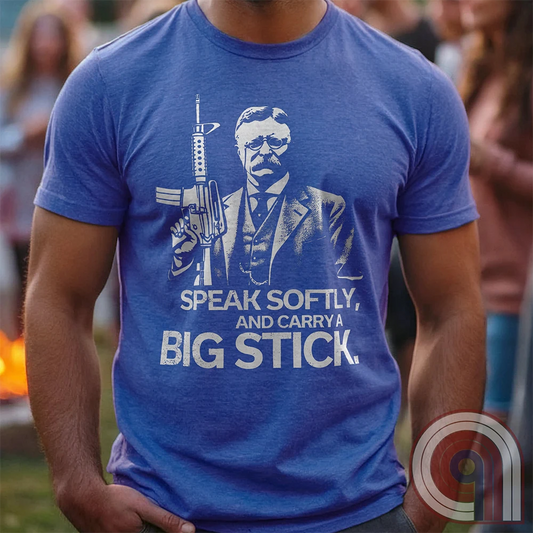Striking Teddy Roosevelt 2A T-Shirt - legendary Rough Rider and American icon, with an AR-15 and his, 'Speak Softly, and Carry a Big Stick.' This design is a fearless blend of patriotism, rugged individuality, & Second Amendment rights. Perfect for gun lovers, history buffs, & freedom fighters who embrace bold American values. Pro-Second Amendment clothing that makes a statement—real leaders don’t ask permission to defend liberty. A tribute to freedom, strength, and the right to bear arms. Color- Blue1