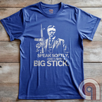 Striking Teddy Roosevelt 2A T-Shirt - legendary Rough Rider and American icon, with an AR-15 and his, 'Speak Softly, and Carry a Big Stick.' This design is a fearless blend of patriotism, rugged individuality, & Second Amendment rights. Perfect for gun lovers, history buffs, & freedom fighters who embrace bold American values. Pro-Second Amendment clothing that makes a statement—real leaders don’t ask permission to defend liberty. A tribute to freedom, strength, and the right to bear arms. Color- Blue2