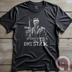 Striking Teddy Roosevelt 2A T-Shirt - legendary Rough Rider and American icon, with an AR-15 and his, 'Speak Softly, and Carry a Big Stick.' This design is a fearless blend of patriotism, rugged individuality, & Second Amendment rights. Perfect for gun lovers, history buffs, & freedom fighters who embrace bold American values. Pro-Second Amendment clothing that makes a statement—real leaders don’t ask permission to defend liberty. A tribute to freedom, strength, and the right to bear arms. Color- Charc2