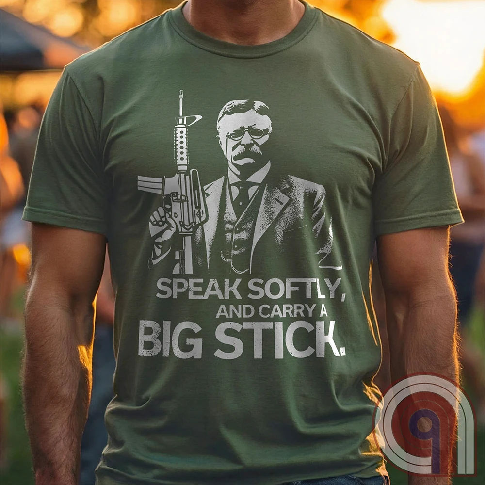 Striking Teddy Roosevelt 2A T-Shirt - legendary Rough Rider and American icon, with an AR-15 and his, 'Speak Softly, and Carry a Big Stick.' This design is a fearless blend of patriotism, rugged individuality, & Second Amendment rights. Perfect for gun lovers, history buffs, & freedom fighters who embrace bold American values. Pro-Second Amendment clothing that makes a statement—real leaders don’t ask permission to defend liberty. A tribute to freedom, strength, and the right to bear arms. Color- Green1