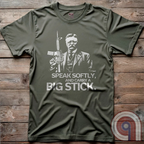 Striking Teddy Roosevelt 2A T-Shirt - legendary Rough Rider and American icon, with an AR-15 and his, 'Speak Softly, and Carry a Big Stick.' This design is a fearless blend of patriotism, rugged individuality, & Second Amendment rights. Perfect for gun lovers, history buffs, & freedom fighters who embrace bold American values. Pro-Second Amendment clothing that makes a statement—real leaders don’t ask permission to defend liberty. A tribute to freedom, strength, and the right to bear arms. Color- Green2
