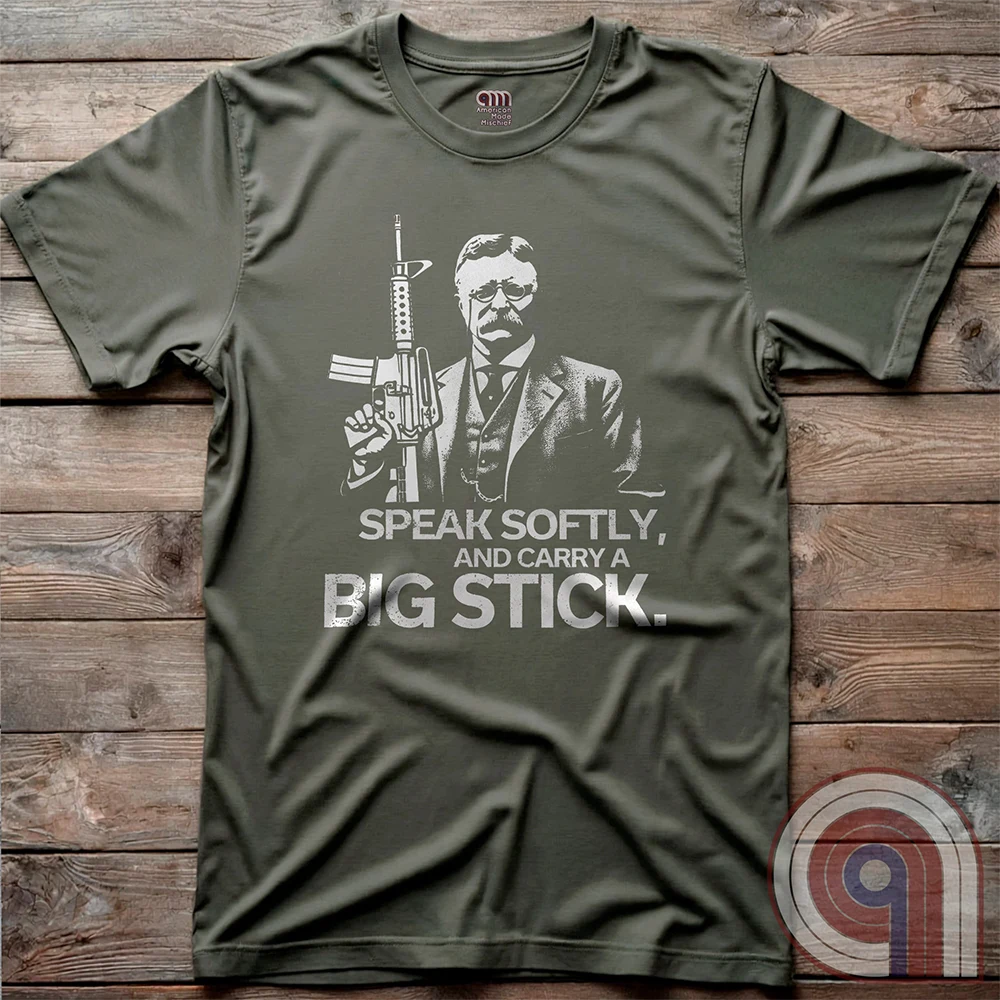 Striking Teddy Roosevelt 2A T-Shirt - legendary Rough Rider and American icon, with an AR-15 and his, 'Speak Softly, and Carry a Big Stick.' This design is a fearless blend of patriotism, rugged individuality, & Second Amendment rights. Perfect for gun lovers, history buffs, & freedom fighters who embrace bold American values. Pro-Second Amendment clothing that makes a statement—real leaders don’t ask permission to defend liberty. A tribute to freedom, strength, and the right to bear arms. Color- Green2