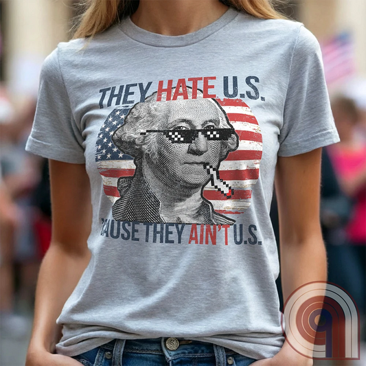 Boldly declare American independence with this They Hate U.S. 'Cause They Ain't U.S. t-shirt - A thug-life George Washington smoking in pixelated shades in front of a distressed American flag. A rebellious thug meme tee that mocks globalists, elitists, and jealous anti-American haters. Perfect for patriots, freedom lovers, & those who embrace the outlaw spirit of 1776. Show your unapologetic pride in American sovereignty, self-reliance, & the right to bear arms with this badass graphic. Color-Ash1