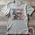 Boldly declare American independence with this They Hate U.S. 'Cause They Ain't U.S. t-shirt - A thug-life George Washington smoking in pixelated shades in front of a distressed American flag. A rebellious thug meme tee that mocks globalists, elitists, and jealous anti-American haters. Perfect for patriots, freedom lovers, & those who embrace the outlaw spirit of 1776. Show your unapologetic pride in American sovereignty, self-reliance, & the right to bear arms with this badass graphic. Color-Ash2
