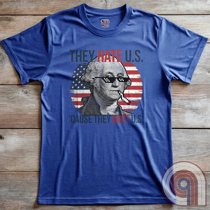 Boldly declare American independence with this They Hate U.S. 'Cause They Ain't U.S. t-shirt - A thug-life George Washington smoking in pixelated shades in front of a distressed American flag. A rebellious thug meme tee that mocks globalists, elitists, and jealous anti-American haters. Perfect for patriots, freedom lovers, & those who embrace the outlaw spirit of 1776. Show your unapologetic pride in American sovereignty, self-reliance, & the right to bear arms with this badass graphic. Color-Blue2