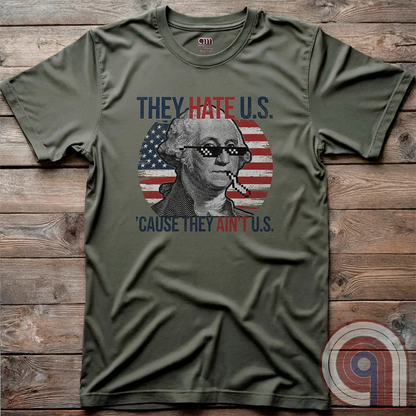 Boldly declare American independence with this They Hate U.S. 'Cause They Ain't U.S. t-shirt - A thug-life George Washington smoking in pixelated shades in front of a distressed American flag. A rebellious thug meme tee that mocks globalists, elitists, and jealous anti-American haters. Perfect for patriots, freedom lovers, & those who embrace the outlaw spirit of 1776. Show your unapologetic pride in American sovereignty, self-reliance, & the right to bear arms with this badass graphic. Color-Green2
