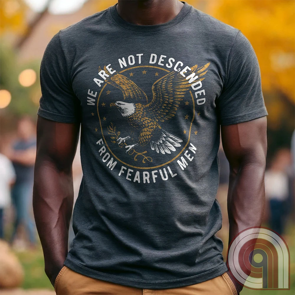 Defy fear and embrace American strength with this bold 'We Are Not Descended from Fearful Men' t-shirt. Featuring a fierce bald eagle, vintage stars, and distressed lettering, this design is a tribute to courage, resilience, & independence. Inspired by the unwavering spirit of the Founding Fathers, this patriotic tee is perfect for veterans, freedom fighters, & anyone who won’t back down. A statement piece for Americans who refuse to live in fear and believe liberty must be defended at all costs; Color:Char