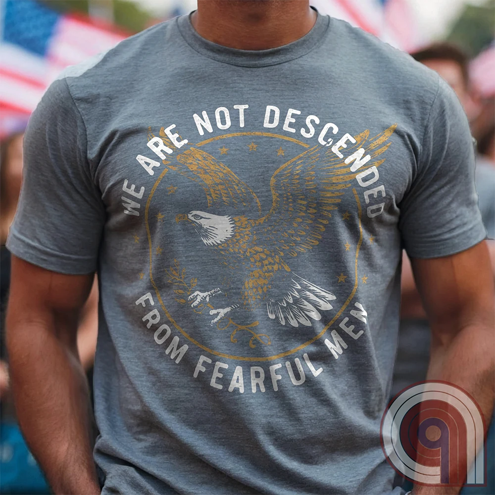 Defy fear and embrace American strength with this bold 'We Are Not Descended from Fearful Men' t-shirt. Featuring a fierce bald eagle, vintage stars, and distressed lettering, this design is a tribute to courage, resilience, & independence. Inspired by the unwavering spirit of the Founding Fathers, this patriotic tee is perfect for veterans, freedom fighters, & anyone who won’t back down. A statement piece for Americans who refuse to live in fear and believe liberty must be defended at all costs;Color:Grey2