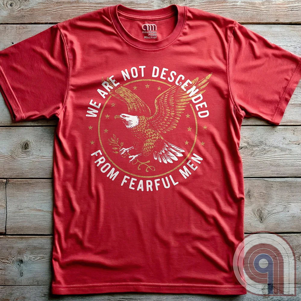 Defy fear and embrace American strength with this bold 'We Are Not Descended from Fearful Men' t-shirt. Featuring a fierce bald eagle, vintage stars, and distressed lettering, this design is a tribute to courage, resilience, & independence. Inspired by the unwavering spirit of the Founding Fathers, this patriotic tee is perfect for veterans, freedom fighters, & anyone who won’t back down. A statement piece for Americans who refuse to live in fear and believe liberty must be defended at all costs; Color: Red