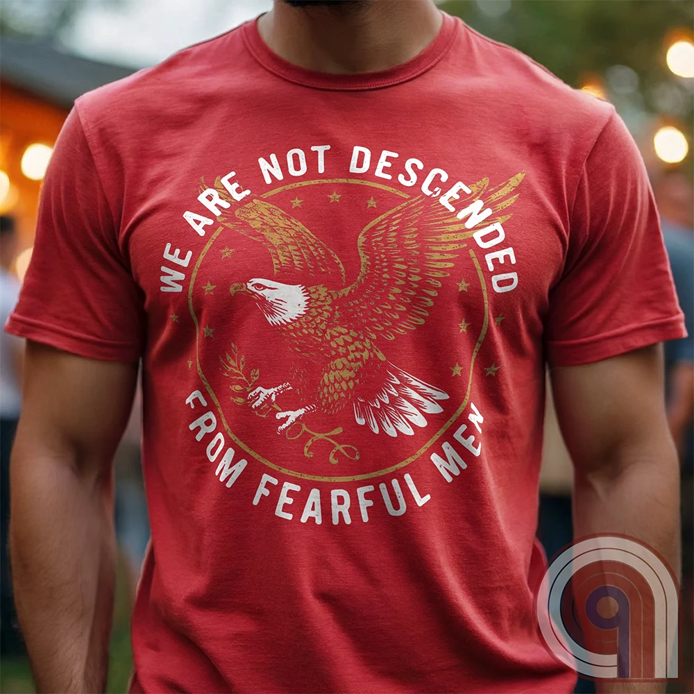 Defy fear and embrace American strength with this bold 'We Are Not Descended from Fearful Men' t-shirt. Featuring a fierce bald eagle, vintage stars, and distressed lettering, this design is a tribute to courage, resilience, & independence. Inspired by the unwavering spirit of the Founding Fathers, this patriotic tee is perfect for veterans, freedom fighters, & anyone who won’t back down. A statement piece for Americans who refuse to live in fear and believe liberty must be defended at all costs; Color:Red2