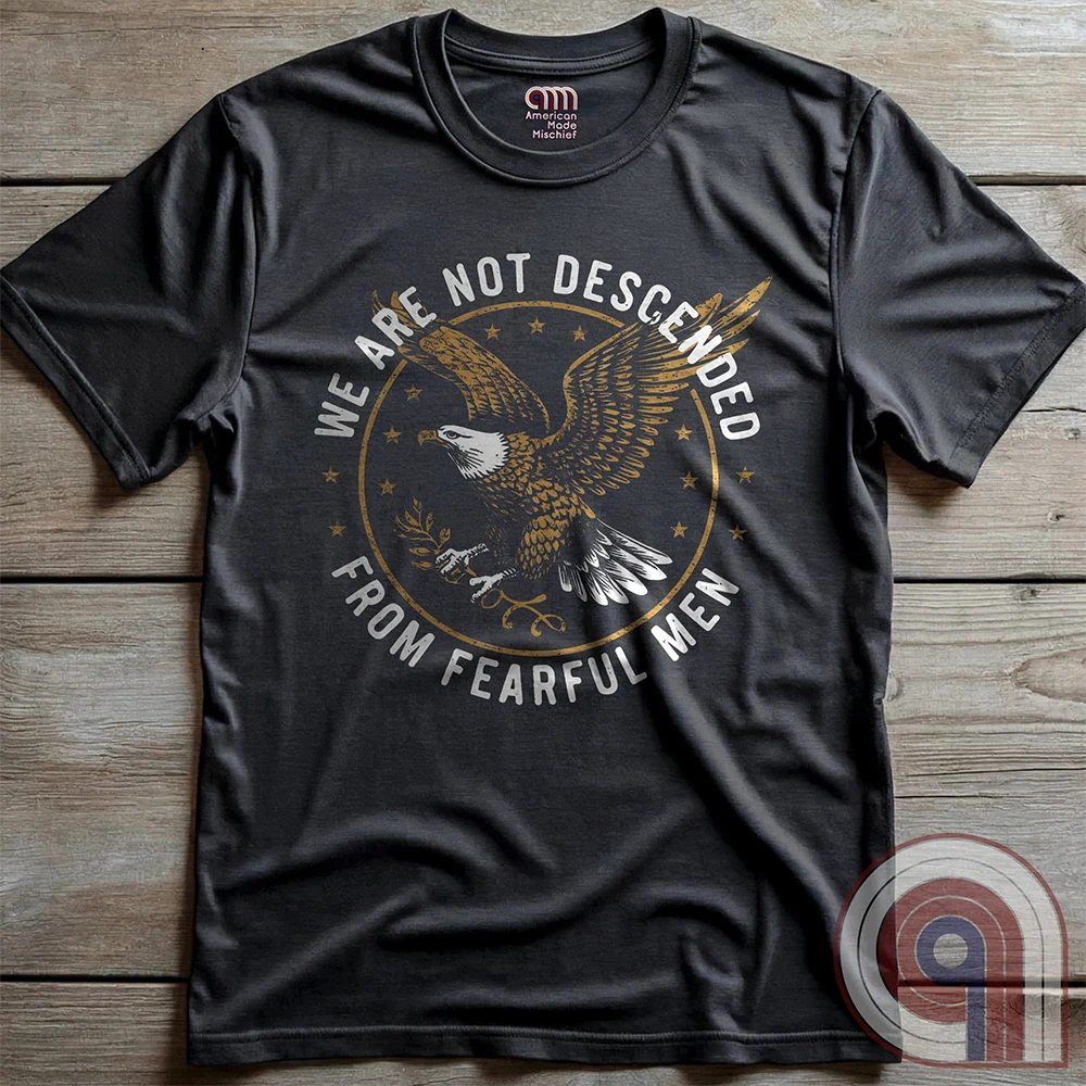 Defy fear and embrace American strength with this bold 'We Are Not Descended from Fearful Men' t-shirt. Featuring a fierce bald eagle, vintage stars, and distressed lettering, this design is a tribute to courage, resilience, & independence. Inspired by the unwavering spirit of the Founding Fathers, this patriotic tee is perfect for veterans, freedom fighters, & anyone who won’t back down. A statement piece for Americans who refuse to live in fear and believe liberty must be defended at all costs; Color:Char