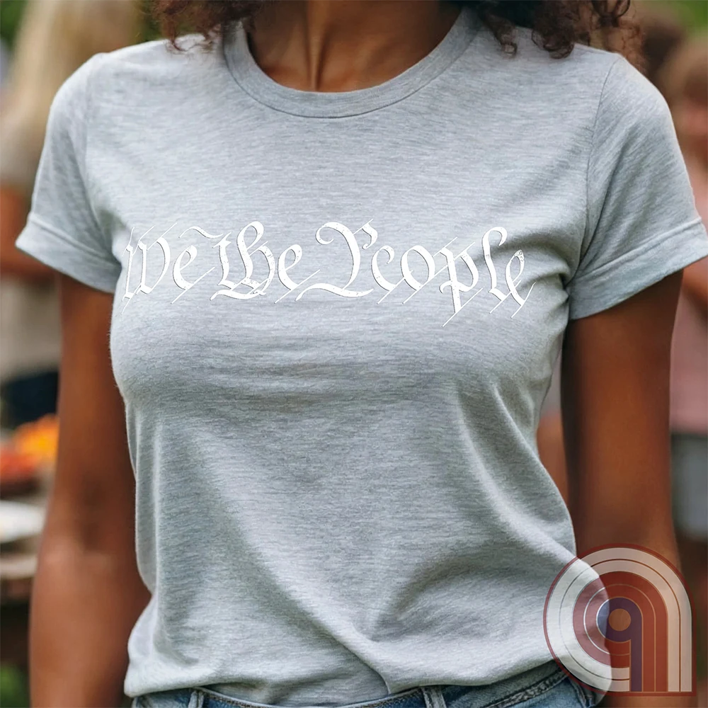 Show your patriotism with this bold 'We The People' t-shirt, inspired by the U.S. Constitution. Featuring classic calligraphy from the founding document, this design represents American freedom, liberty, & the power of the people. Perfect for proud patriots, constitutionalists, & those who stand for individual rights. Celebrate the Bill of Rights, defend the Second Amendment, & stand for limited government with this statement of American values, independence, self-governance, & personal liberty. Color- Ash2