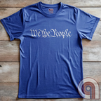 Show your patriotism with this bold 'We The People' t-shirt, inspired by the U.S. Constitution. Featuring classic calligraphy from the founding document, this design represents American freedom, liberty, & the power of the people. Perfect for proud patriots, constitutionalists, & those who stand for individual rights. Celebrate the Bill of Rights, defend the Second Amendment, & stand for limited government with this statement of American values, independence, self-governance, & personal liberty. Color- Blue