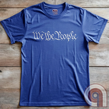 Show your patriotism with this bold 'We The People' t-shirt, inspired by the U.S. Constitution. Featuring classic calligraphy from the founding document, this design represents American freedom, liberty, & the power of the people. Perfect for proud patriots, constitutionalists, & those who stand for individual rights. Celebrate the Bill of Rights, defend the Second Amendment, & stand for limited government with this statement of American values, independence, self-governance, & personal liberty. Color- Blue
