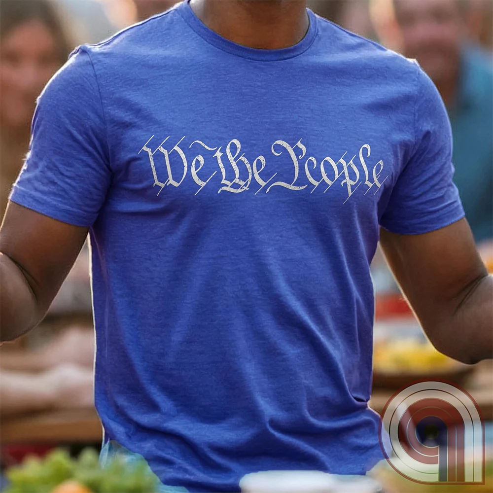 Show your patriotism with this bold 'We The People' t-shirt, inspired by the U.S. Constitution. Featuring classic calligraphy from the founding document, this design represents American freedom, liberty, & the power of the people. Perfect for proud patriots, constitutionalists, & those who stand for individual rights. Celebrate the Bill of Rights, defend the Second Amendment, & stand for limited government with this statement of American values, independence, self-governance, & personal liberty. Color-Blue2