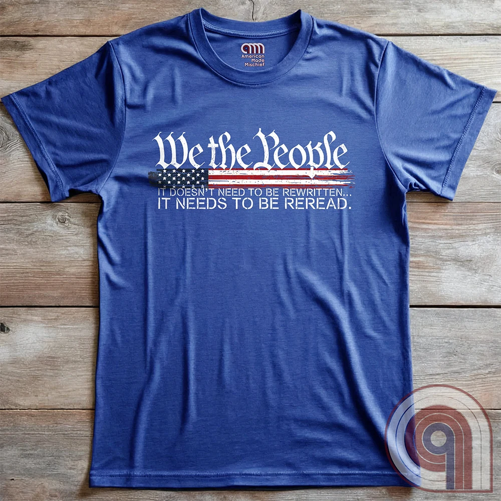 Show your patriotism with this bold 'We The People' t-shirt, featuring the iconic preamble of the U.S. Constitution. With a distressed American flag backdrop, this design is a statement for those who believe in defending the Constitution, freedom, & liberty. Ideal for patriots, conservatives, and constitutionalists who value the Bill of Rights & American history. A must-have for those who oppose government overreach, censorship, and revisionist history. Wear it proudly as a tribute to America. Color: Blue