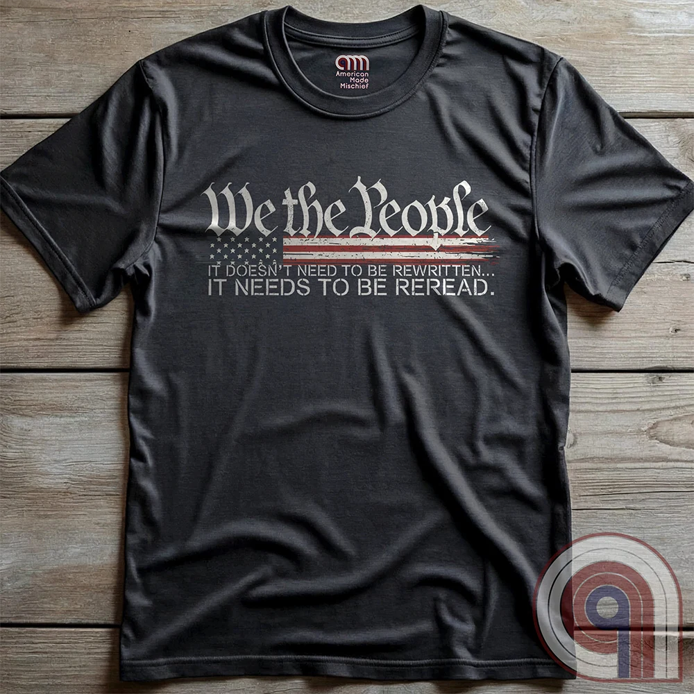 Show your patriotism with this bold 'We The People' t-shirt, featuring the iconic preamble of the U.S. Constitution. With a distressed American flag backdrop, this design is a statement for those who believe in defending the Constitution, freedom, & liberty. Ideal for patriots, conservatives, and constitutionalists who value the Bill of Rights & American history. A must-have for those who oppose government overreach, censorship, and revisionist history. Wear it proudly as a tribute to America. Color: Charc