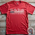 Show your patriotism with this bold 'We The People' t-shirt, featuring the iconic preamble of the U.S. Constitution. With a distressed American flag backdrop, this design is a statement for those who believe in defending the Constitution, freedom, & liberty. Ideal for patriots, conservatives, and constitutionalists who value the Bill of Rights & American history. A must-have for those who oppose government overreach, censorship, and revisionist history. Wear it proudly as a tribute to America. Color: Red