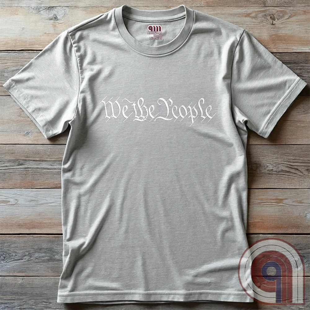 Show your patriotism with this bold 'We The People' t-shirt, inspired by the U.S. Constitution. Featuring classic calligraphy from the founding document, this design represents American freedom, liberty, & the power of the people. Perfect for proud patriots, constitutionalists, & those who stand for individual rights. Celebrate the Bill of Rights, defend the Second Amendment, & stand for limited government with this statement of American values, independence, self-governance, & personal liberty. Color- Ash
