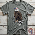 Declare your independence with this striking Pro USA t-shirt featuring America’s ultimate symbol of freedom—the bald eagle—sporting American flag sunglasses. It’s not just a patriotic tee—it’s a statement of strength, sovereignty, and pride. 
Bald eagle t-shirt;Patriotic eagle shirt;American flag sunglasses design;USA freedom shirt;Pro-America graphic tee;Unisex patriotic t-shirt;Eagle with American flag glasses shirt;Conservative values;July 4th eagle t-shirt;USA-made freedom apparel;MAGA;1776; - Grey
