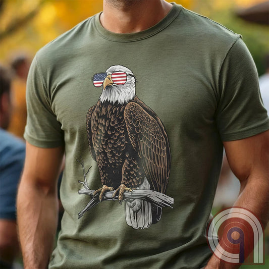 Declare your independence with this striking Pro USA t-shirt featuring America’s ultimate symbol of freedom—the bald eagle—sporting American flag sunglasses. It’s not just a patriotic tee—it’s a statement of strength, sovereignty, and pride. 
Bald eagle t-shirt;Patriotic eagle shirt;American flag sunglasses design;USA freedom shirt;Pro-America graphic tee;Unisex patriotic t-shirt;Eagle with American flag glasses shirt;Conservative values;July 4th eagle t-shirt;USA-made freedom apparel;MAGA;1776; - Green