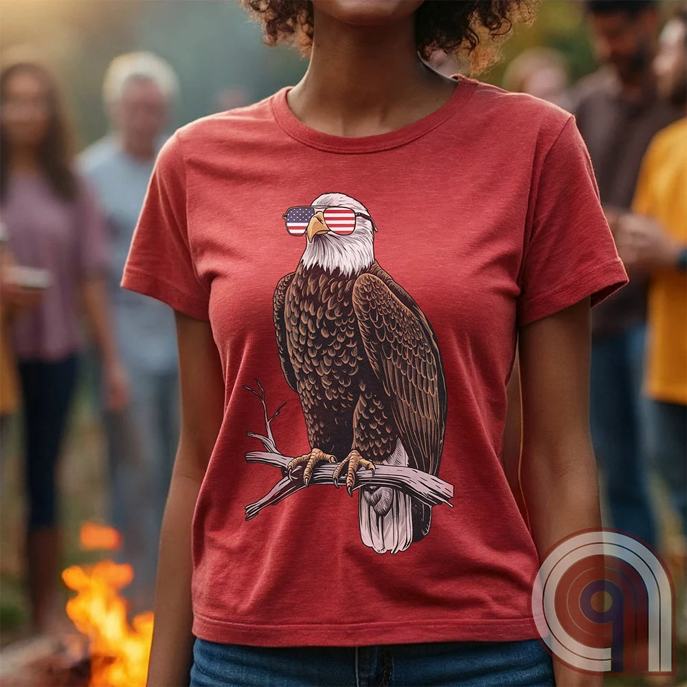 Declare your independence with this striking Pro USA t-shirt featuring America’s ultimate symbol of freedom—the bald eagle—sporting American flag sunglasses. It’s not just a patriotic tee—it’s a statement of strength, sovereignty, and pride. 
Bald eagle t-shirt;Patriotic eagle shirt;American flag sunglasses design;USA freedom shirt;Pro-America graphic tee;Unisex patriotic t-shirt;Eagle with American flag glasses shirt;Conservative values;July 4th eagle t-shirt;USA-made freedom apparel;MAGA;1776; - Red
