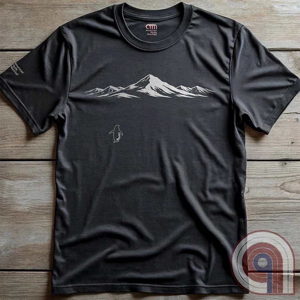 Minimalist inspirational t-shirt graphic showing a lone penguin walking away beneath a vast snow-covered mountain range, inspired by Werner Herzog’s wandering penguin documentary scene. This Tee evokes existential solitude, Faustian spirit, nihilism, faith, and quiet bravery, symbolizing the call to adventure, isolation, perseverance, philosophy, and the human search for meaning through nature, exploration, and understated surreal meme culture.
Charc