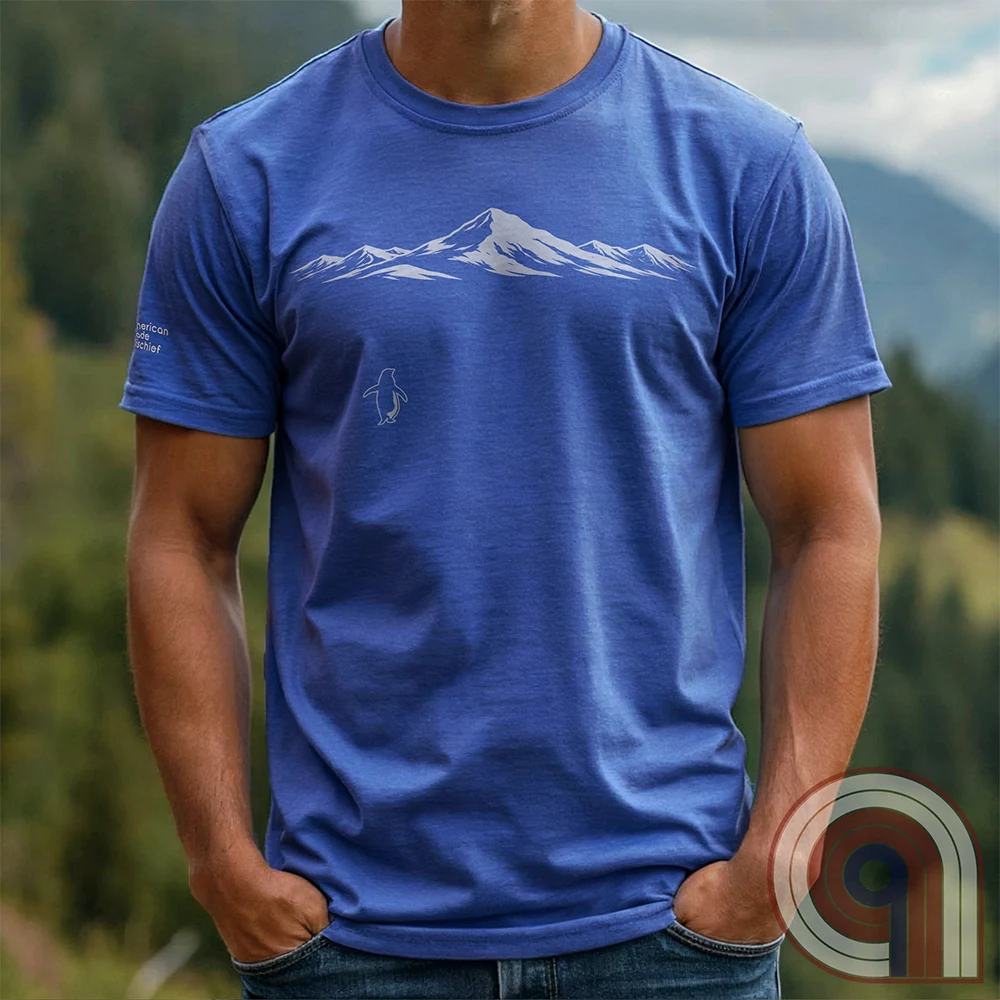Minimalist inspirational t-shirt graphic showing a lone penguin walking away beneath a vast snow-covered mountain range, inspired by Werner Herzog’s wandering penguin documentary scene. This Tee evokes existential solitude, Faustian spirit, nihilism, faith, and quiet bravery, symbolizing the call to adventure, isolation, perseverance, philosophy, and the human search for meaning through nature, exploration, and understated surreal meme culture. 
Blue