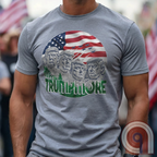 Mount Trumpmore stands as a bold symbol of American resilience, patriotism, and leadership. This striking t-shirt reimagines a national monument in the image of Donald Trump, embodying strength, defiance, & commitment to America first. Set against the stars & stripes, this shirt captures the grandeur of a historical moment & the glory of a triumphant return. For patriots who refuse to let America fade, this tee celebrates leadership and a vision of American greatness carved into history. Color- Grey1