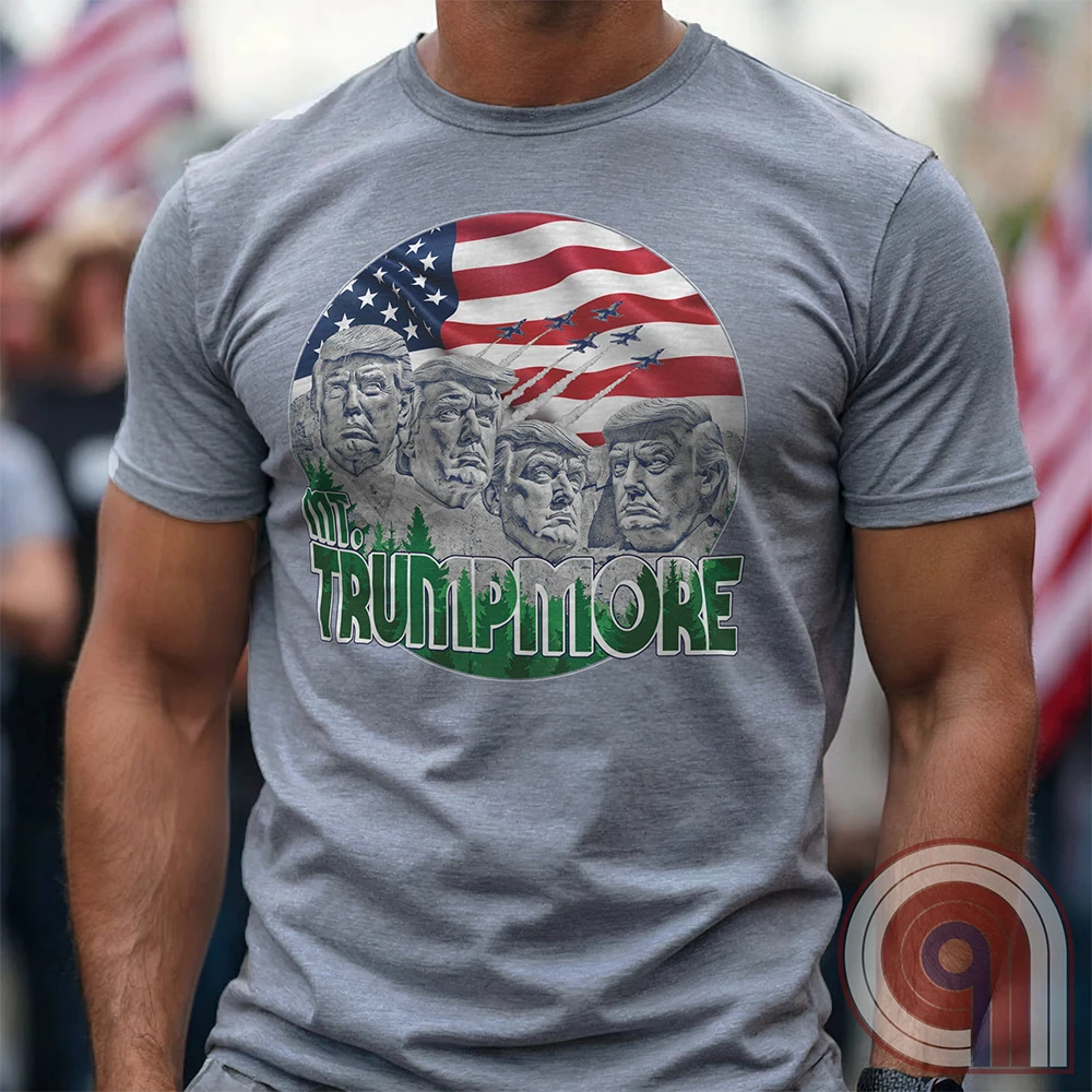 Mount Trumpmore stands as a bold symbol of American resilience, patriotism, and leadership. This striking t-shirt reimagines a national monument in the image of Donald Trump, embodying strength, defiance, & commitment to America first. Set against the stars & stripes, this shirt captures the grandeur of a historical moment & the glory of a triumphant return. For patriots who refuse to let America fade, this tee celebrates leadership and a vision of American greatness carved into history. Color- Grey1