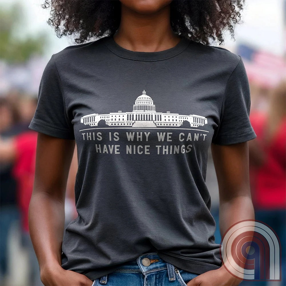 "This Is Why We Can't Have Nice Things" political satire t-shirt exposing congressional corruption, government waste, & the reckless mismanagement of American resources. Featuring bold typography and a minimalist design, this anti-establishment tee makes a statement against fraud, bureaucratic incompetence, & the squandering of taxpayer dollars. A must-have for those who demand accountability & transparency from elected officials. Wear it loud and proud to call out the system’s failures. Color- Charc1