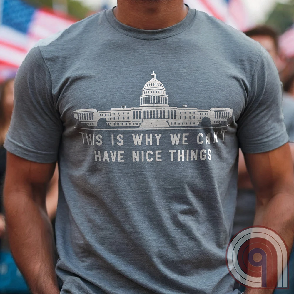 "This Is Why We Can't Have Nice Things" political satire t-shirt exposing congressional corruption, government waste, & the reckless mismanagement of American resources. Featuring bold typography and a minimalist design, this anti-establishment tee makes a statement against fraud, bureaucratic incompetence, & the squandering of taxpayer dollars. A must-have for those who demand accountability & transparency from elected officials. Wear it loud and proud to call out the system’s failures. Color- Grey1