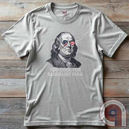 Bold and electrifying, this Too Cool for Globalist Rule t-shirt features Ben Franklin rocking patriotic American flag sunglasses, radiating defiance against tyranny. With a lightning bolt in the backdrop, this anti-globalist, pro-sovereignty design embodies the rebellious spirit of American independence. Inspired by Franklin’s quote “Rebellion to tyrants is obedience to God”, this patriotic tee is a warning to globalist elites, communists, and tyrants—freedom-loving Americans won’t kneel. Color- Ash2