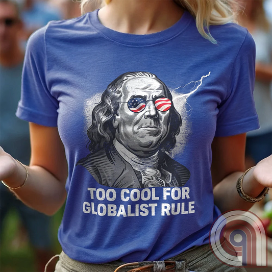 Bold and electrifying, this Too Cool for Globalist Rule t-shirt features Ben Franklin rocking patriotic American flag sunglasses, radiating defiance against tyranny. With a lightning bolt in the backdrop, this anti-globalist, pro-sovereignty design embodies the rebellious spirit of American independence. Inspired by Franklin’s quote “Rebellion to tyrants is obedience to God”, this patriotic tee is a warning to globalist elites, communists, and tyrants—freedom-loving Americans won’t kneel. Color- Blue1