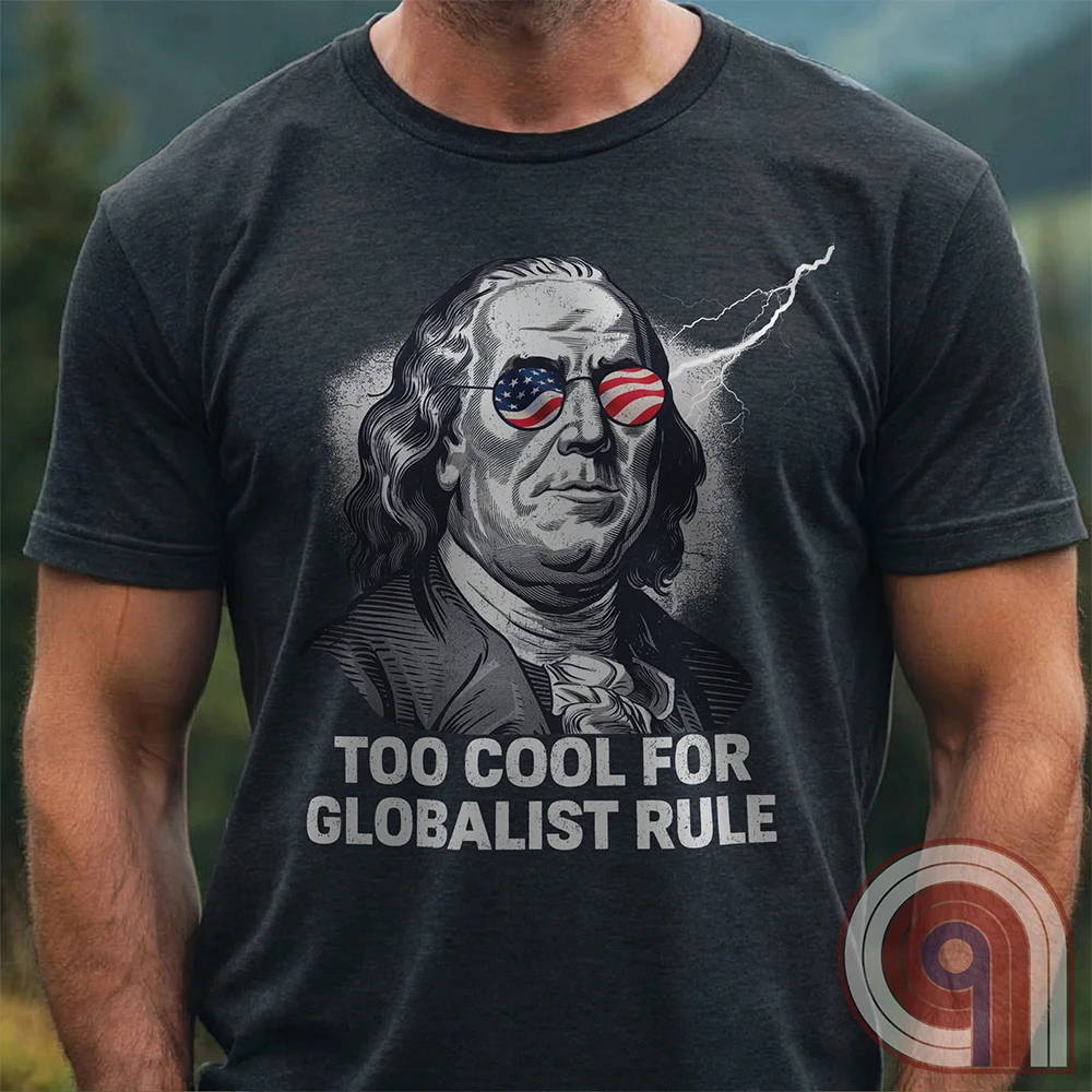 Bold and electrifying, this Too Cool for Globalist Rule t-shirt features Ben Franklin rocking patriotic American flag sunglasses, radiating defiance against tyranny. With a lightning bolt in the backdrop, this anti-globalist, pro-sovereignty design embodies the rebellious spirit of American independence. Inspired by Franklin’s quote “Rebellion to tyrants is obedience to God”, this patriotic tee is a warning to globalist elites, communists, and tyrants—freedom-loving Americans won’t kneel. Color- Charc1