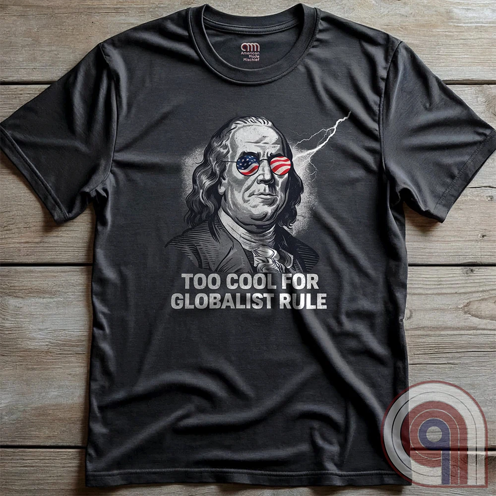 Bold and electrifying, this Too Cool for Globalist Rule t-shirt features Ben Franklin rocking patriotic American flag sunglasses, radiating defiance against tyranny. With a lightning bolt in the backdrop, this anti-globalist, pro-sovereignty design embodies the rebellious spirit of American independence. Inspired by Franklin’s quote “Rebellion to tyrants is obedience to God”, this patriotic tee is a warning to globalist elites, communists, and tyrants—freedom-loving Americans won’t kneel. Color- Charc2