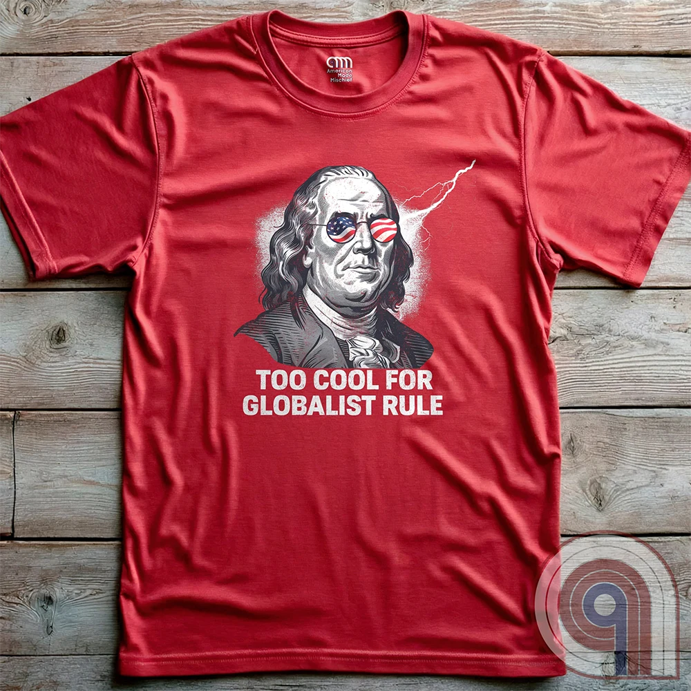 Bold and electrifying, this Too Cool for Globalist Rule t-shirt features Ben Franklin rocking patriotic American flag sunglasses, radiating defiance against tyranny. With a lightning bolt in the backdrop, this anti-globalist, pro-sovereignty design embodies the rebellious spirit of American independence. Inspired by Franklin’s quote “Rebellion to tyrants is obedience to God”, this patriotic tee is a warning to globalist elites, communists, and tyrants—freedom-loving Americans won’t kneel. Color-Red2
