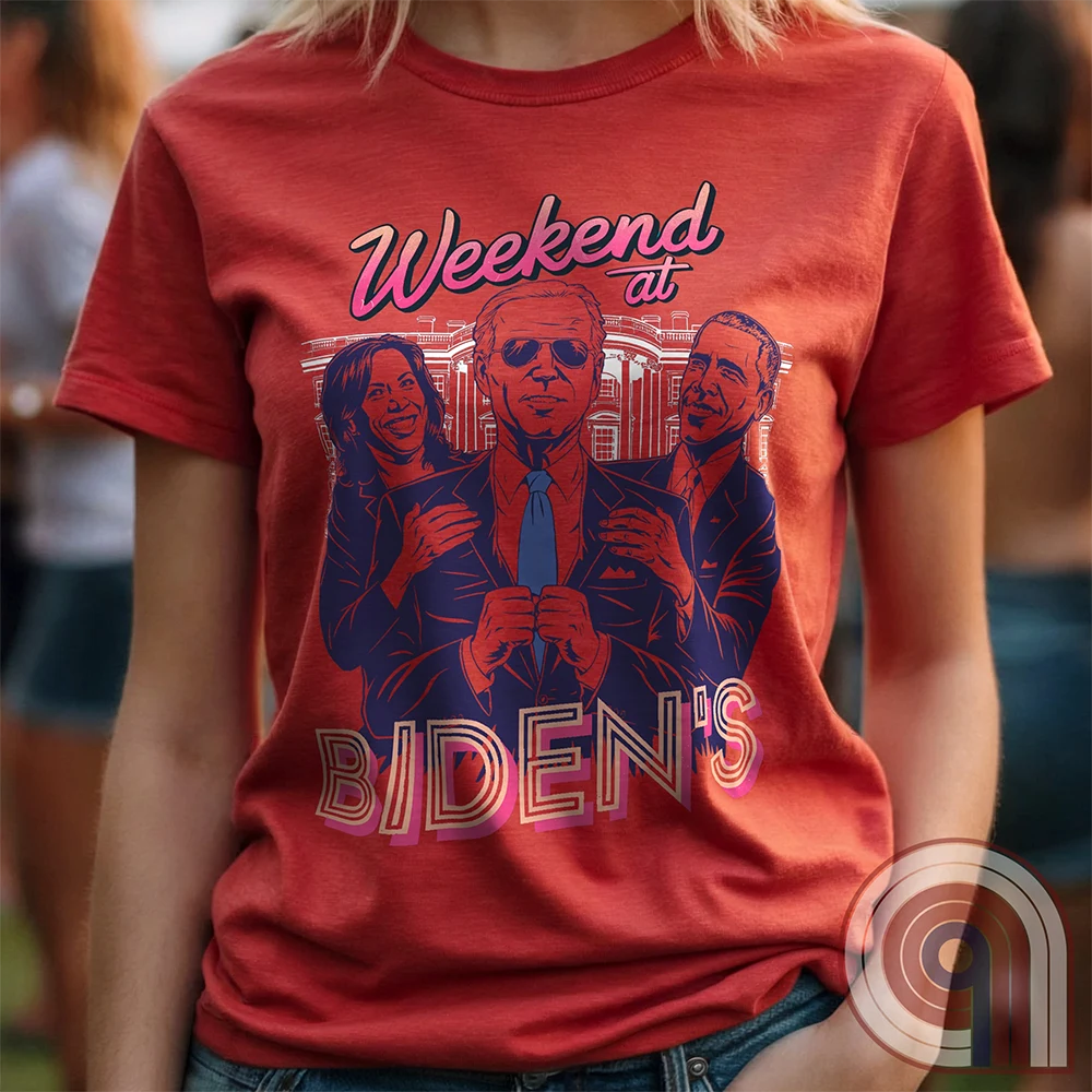 A hilarious political satire t-shirt featuring "Weekend at Biden’s," a parody of the classic comedy, reimagined with Joe Biden as the lifeless puppet propped up by Kamala Harris & Barack Obama. With a retro 80s aesthetic, this anti-establishment tee calls out the illusion of leadership & the deep-state handlers pulling the strings. A must-have for conservatives, libertarians, & free-thinkers who see through the charade. Perfect for rallies, protests, or just triggering clueless liberals! Color - Red1